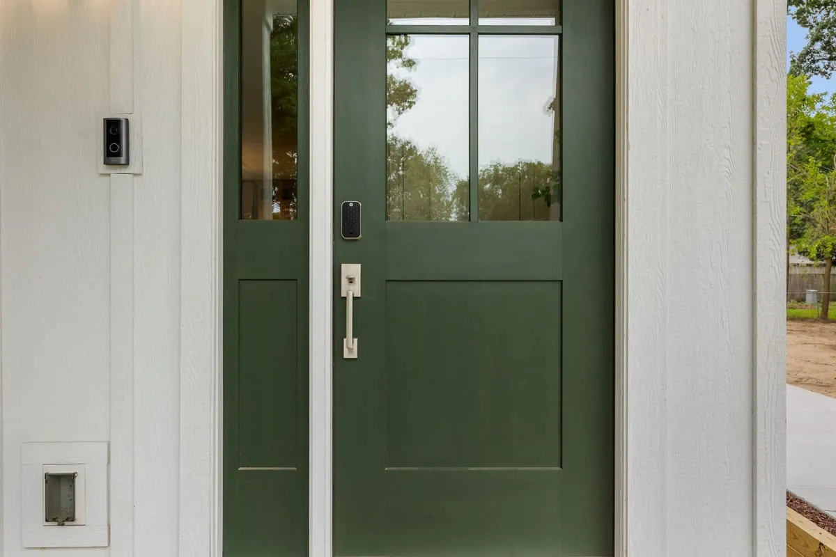 Green front door of a managed home