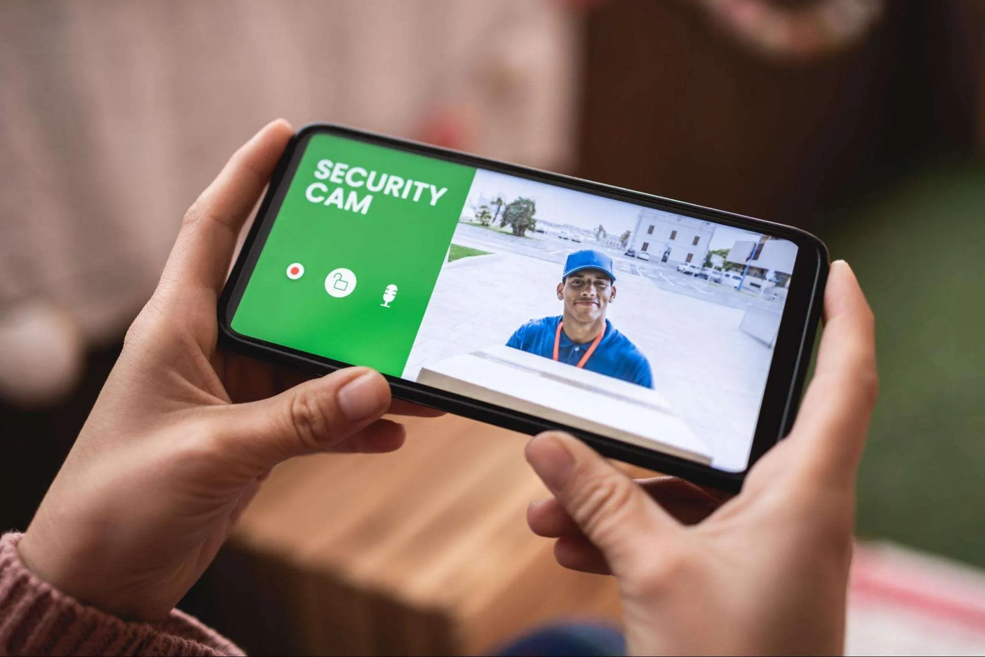 Checking a home security camera on a phone