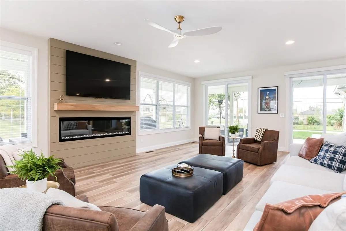 Bright living room with a fireplace and leather seating